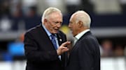Dallas Cowboys owner Jerry Jones talks to Philadelphia Eagles owner Jeffrey Lurie before a game.