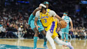 Jan 27, 2025; Charlotte, North Carolina, USA; Los Angeles Lakers forward Anthony Davis (3) drives to the basket against Charlotte Hornets center Mark Williams (5) during the first quarter at the Spectrum Center. Mandatory Credit: Jim Dedmon-Imagn Images