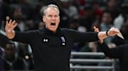 Mar 13, 2025; Indianapolis, IN, USA; Northwestern Wildcats head coach Chris Collins reacts to a play during the first half against the Wisconsin Badgers at Gainbridge Fieldhouse. Mandatory Credit: Robert Goddin-Imagn Images