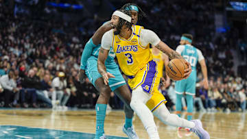 Jan 27, 2025; Charlotte, North Carolina, USA; Los Angeles Lakers forward Anthony Davis (3) drives to the basket against Charlotte Hornets center Mark Williams (5) during the first quarter at the Spectrum Center. Mandatory Credit: Jim Dedmon-Imagn Images