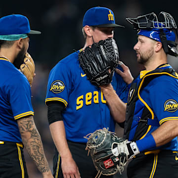 Seattle Mariners catcher Cal Raleigh (right) speaks to his teammates during a game against the Texas Rangers on Friday at T-Mobile Park.