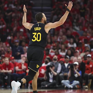 May 4, 2025; Houston, Texas, USA; Golden State Warriors guard Stephen Curry (30) reacts after making a basket during the first quarter of game seven of the first round for the 2025 NBA Playoffs against the Houston Rockets at Toyota Center. Mandatory Credit: Troy Taormina-Imagn Images