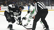 Dec 4, 2024; Los Angeles, California, USA; Los Angeles Kings center Anze Kopitar (11) faces off against Dallas Stars left wing Jamie Benn (14) during the third period of a hockey game at Crypto.com Arena. Mandatory Credit: Jessica Alcheh-Imagn Images