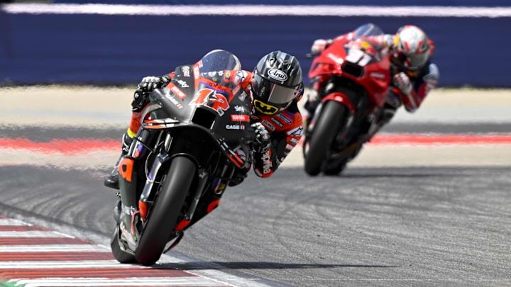 Apr 14, 2024; Austin, TX, USA; Maverick Vinales (12) of Spain and Aprilia Racing leads Pedro Acosta (31) of Spain and Red Bull Tech3 GASGAS during the MotoGP Grand Prix of The Americas at Circuit of The Americas. Mandatory Credit: Jerome Miron-Imagn Images