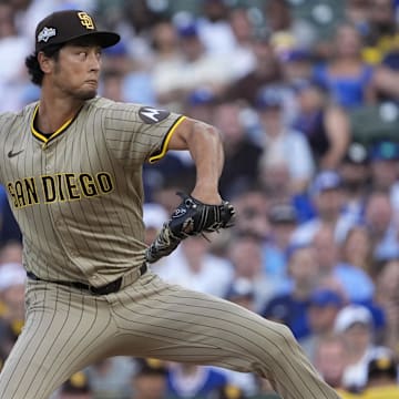 Oct 2, 2025; Chicago, Illinois, USA; San Diego Padres starting pitcher Yu Darvish (11) throws during the first inning against the Chicago Cubs during game three of the Wildcard round for the 2025 MLB playoffs at Wrigley Field. Mandatory Credit: David Banks-Imagn Images