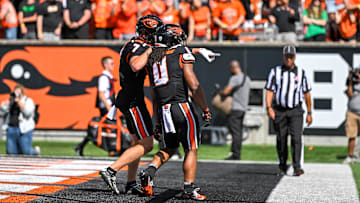 Sep 14, 2024; Corvallis, Oregon, USA; Oregon State Beavers wide receiver Trent Walker (7) celebrates a touchdown by running back Anthony Hankerson (0) during the second quarter against the Oregon Ducks at Reser Stadium. Mandatory Credit: Craig Strobeck-Imagn Images