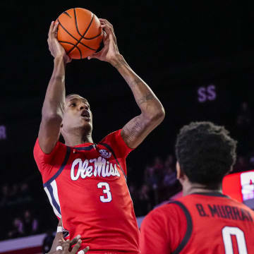 Mar 5, 2024; Athens, Georgia, USA; Mississippi Rebels forward Jamarion Sharp (3) grabs a rebound over Georgia Bulldogs center Russel Tchewa (54) during the second half at Stegeman Coliseum. Mandatory Credit: Dale Zanine-USA TODAY Sports