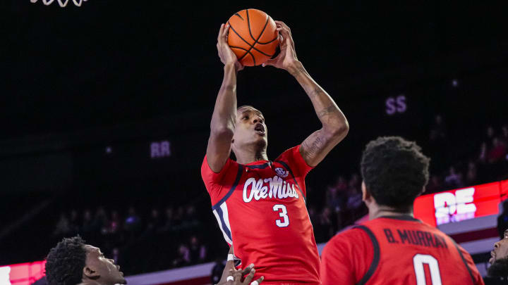 Mar 5, 2024; Athens, Georgia, USA; Mississippi Rebels forward Jamarion Sharp (3) grabs a rebound over Georgia Bulldogs center Russel Tchewa (54) during the second half at Stegeman Coliseum. Mandatory Credit: Dale Zanine-USA TODAY Sports