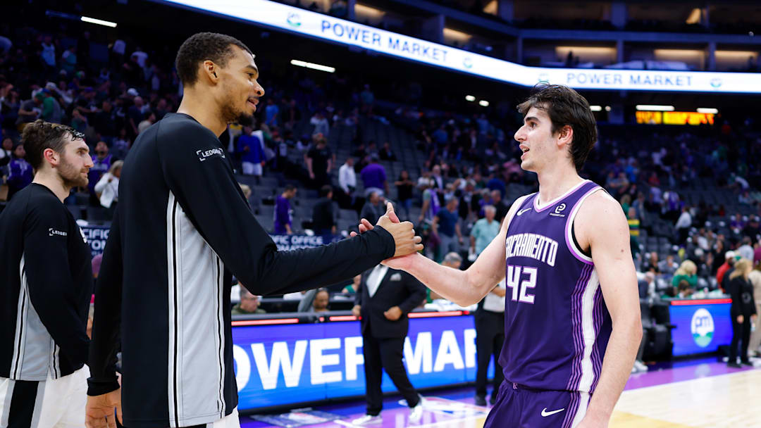 Mar 17, 2026; Sacramento, California, USA; San Antonio Spurs forward Victor Wembanyama (1) and Sacramento Kings center Maxime Raynaud (42) shake hands after the game at Golden 1 Center. Mandatory Credit: Sergio Estrada-Imagn Images
