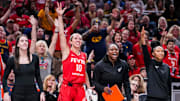 /Indiana Fever guard Caitlin Clark (22), Indiana Fever guard Lexie Hull (10), Indiana Fever assistant coach Karima Christmas-Kelly and Indiana Fever assistant coach Briann January celebrate Friday, Sept. 5, 2025, during a game between the Indiana Fever and the Chicago Sky at Gainbridge Fieldhouse in Indianapolis. The Indiana Fever defeated the Chicago Sky, 97-77.