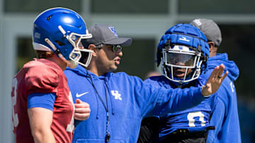 University of Kentucky Offensive Coordinator and Quarterbacks Coach Bush Hamdan speaks to the team during spring football practice on Saturday, April 6, 2024.