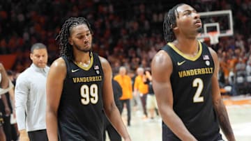 Vanderbilt's Devin McGlockton (99) and Vanderbilt's MJ Collins Jr. (2) walk of the court after a men’s college basketball game between Tennessee and Vanderbilt at Thompson-Boling Arena at Food City Center, Saturday, Feb. 15, 2025.