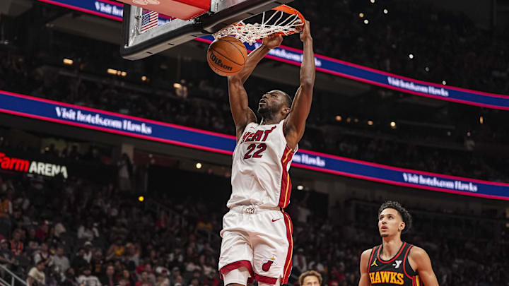 Miami Heat forward Andrew Wiggins (22) dunks behind Atlanta Hawks forward Zaccharie Risacher (10) during the second half at State Farm Arena. Miami Heat forward Andrew Wiggins (22) dunks behind Atlanta Hawks forward Zaccharie Risacher (10) during the second half at State Farm Arena.
