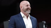 Oct 25, 2024; Portland, Oregon, USA: Portland Trail Blazers general manager Joe Cronin smiles as players warm up before a game against the New Orleans Pelicans at Moda Center. Mandatory Credit: Soobum Im-Imagn Images