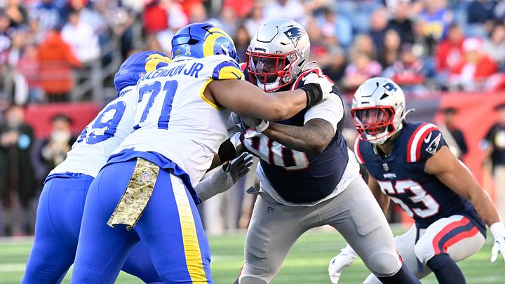 Nov 17, 2024; Foxborough, Massachusetts, USA; New England Patriots defensive tackle Christian Barmore (90) blocks Los Angeles Rams offensive tackle Warren McClendon Jr. (71) during the first half at Gillette Stadium. Mandatory Credit: Eric Canha-Imagn Images