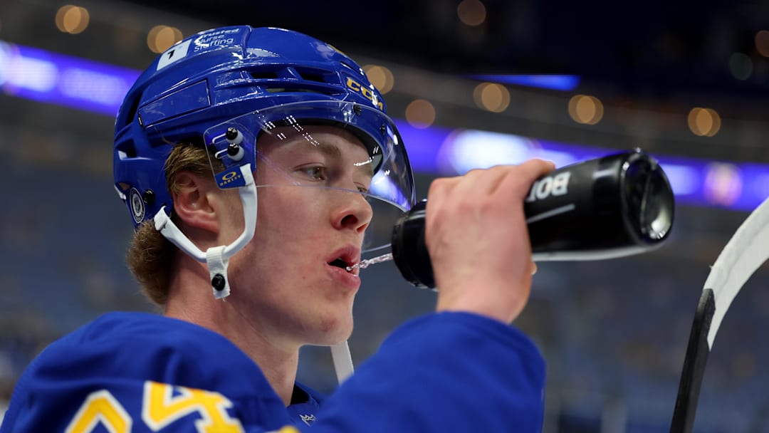 Apr 6, 2025; Buffalo, New York, USA;  Buffalo Sabres defenseman Jacob Bernard-Docker (24) gets a drink during warmups before a game against the Boston Bruins at KeyBank Center. Mandatory Credit: Timothy T. Ludwig-Imagn Images