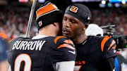 Cincinnati Bengals quarterback Joe Burrow (9) and wide receiver Tee Higgins (5) celebrate the win after overtime of the NFL Week 17 game between the Cincinnati Bengals and the Denver Broncos at Paycor Stadium in downtown Cincinnati on Saturday, Dec. 28, 2024. The Bengals took a 30-24 win in overtime to remain in the post season chase.