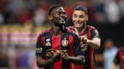 Feb 22, 2025; Atlanta, Georgia, USA; Atlanta United forward Emmanuel Latte Lath (19) celebrates after a goal with forward Miguel Almiron (10) against CF Montreal in the second half at Mercedes-Benz Stadium. Mandatory Credit: Brett Davis-Imagn Images
