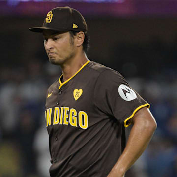 Oct 11, 2024; Los Angeles, California, USA; San Diego Padres pitcher Yu Darvish (11) reacts in the sixth inning against the Los Angeles Dodgers during game five of the NLDS for the 2024 MLB Playoffs at Dodger Stadium. Mandatory Credit: Jayne Kamin-Oncea-Imagn Images