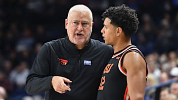 Jan 28, 2025; Spokane, Washington, USA; Oregon State Beavers head coach Wayne Tinkle talks with Oregon State Beavers forward Michael Rataj (12) during a game against the Gonzaga Bulldogs in the second half at McCarthey Athletic Center. Mandatory Credit: James Snook-Imagn Images