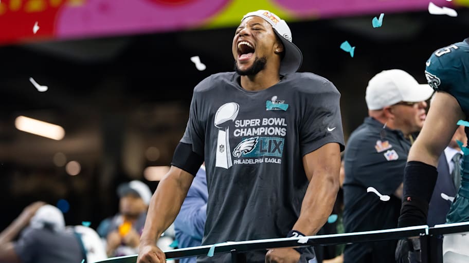 Philadelphia Eagles star running back Saquon Barkley is the toast of the town after the Super Bowl winning running back graced the cover of 'Madden 26.' | Mark J. Rebilas-Imagn Images