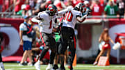 Sep 29, 2024; Tampa, Florida, USA; Tampa Bay Buccaneers running back Rachaad White (1) celebrates with wide receiver Trey Palmer (10) after a touchdown against the Philadelphia Eagles in the first quarter at Raymond James Stadium. Mandatory Credit: Nathan Ray Seebeck-Imagn Images