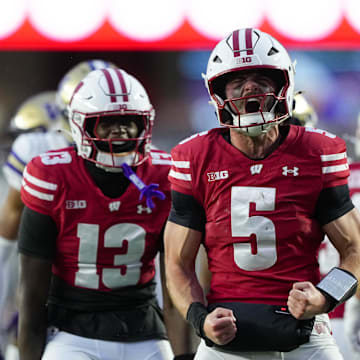 Nov 8, 2025; Madison, Wisconsin, USA;  Wisconsin Badgers quarterback Carter Smith (5) celebrates following a play during the second quarter against the Washington Huskies at Camp Randall Stadium. Mandatory Credit: Jeff Hanisch-Imagn Images