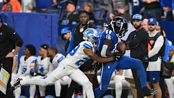 Nov 24, 2024; Indianapolis, Indiana, USA; Indianapolis Colts wide receiver Ashton Dulin (16) catches a pass which is called incomplete under coverage from Detroit Lions cornerback Kindle Vildor (29) during the second half at Lucas Oil Stadium. Mandatory Credit: Marc Lebryk-Imagn Images