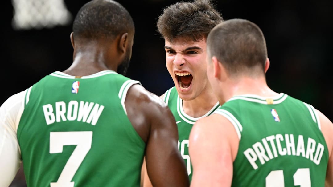 Dec 2, 2025; Boston, Massachusetts, USA; Boston Celtics guard Hugo Gonzalez (28) reacts with guard Jaylen Brown (7) and guard Payton Pritchard (11) during the first half of a game against the New York Knicks at the TD Garden.