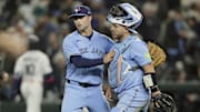 Toronto Blue Jays pitcher Mason Fluharty (68) and catcher Alejandro Kirk (30) celebrate after winning game three of the ALCS round for the 2025 MLB playoffs against the Seattle Mariners at T-Mobile Park. 