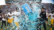 Nov 30, 2024; Tucson, Arizona, USA; Detailed view of drops of gatorade flying as Arizona State Sun Devils head coach Kenny Dillingham is dunked after defeating the Arizona Wildcats in the Territorial Cup at Arizona Stadium. Mandatory Credit: Mark J. Rebilas-Imagn Images