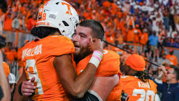 Tennessee quarterback Nico Iamaleava (8) and Tennessee offensive lineman Cooper Mays (63) hug after defeating Florida after a NCAA football game between Tennessee and Florida in Neyland Stadium, in Knoxville, Tenn., Oct. 12, 2024.