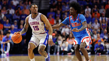 Mar 8, 2025; Gainesville, Florida, USA; Florida Gators guard Alijah Martin (15) dribbles the ball while Mississippi Rebels guard Jaylen Murray (5) defends during the second half at Exactech Arena at the Stephen C. O'Connell Center. Mandatory Credit: Matt Pendleton-Imagn Images