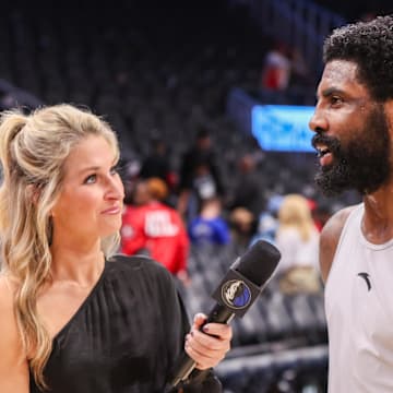 Nov 25, 2024; Atlanta, Georgia, USA; Reporter Lesley McCaslin interviews Dallas Mavericks guard Kyrie Irving (11) after a victory over the Atlanta Hawks at State Farm Arena. Mandatory Credit: Brett Davis-Imagn Images