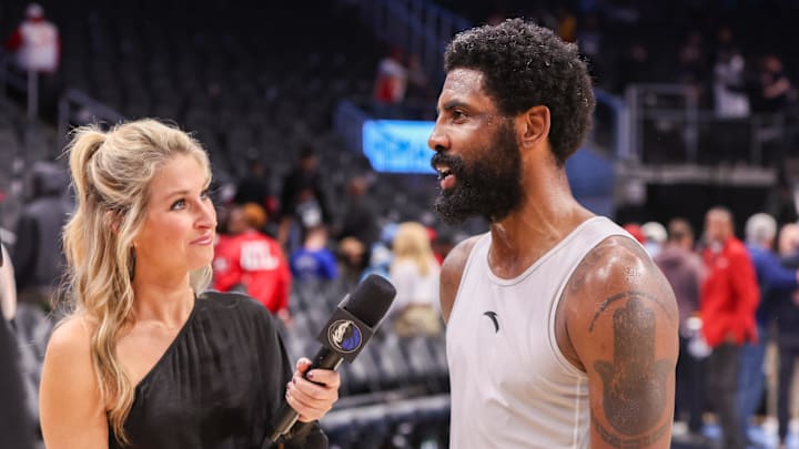 Nov 25, 2024; Atlanta, Georgia, USA; Reporter Lesley McCaslin interviews Dallas Mavericks guard Kyrie Irving (11) after a victory over the Atlanta Hawks at State Farm Arena. Mandatory Credit: Brett Davis-Imagn Images
