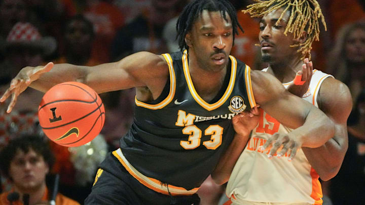 Missouri Tigers center Josh Gray (33) drives on a defender, in a game versus the Tennessee Volunteers this season.