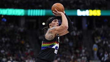 Nov 17, 2025; Denver, Colorado, USA; Denver Nuggets forward Aaron Gordon (32) lines up a shot in the fourth quarter against the Chicago Bulls at Ball Arena. Mandatory Credit: Ron Chenoy-Imagn Images