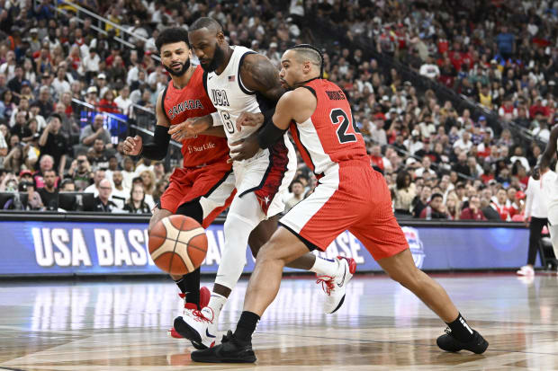 USA forward Lebron James dribbles to the basket.