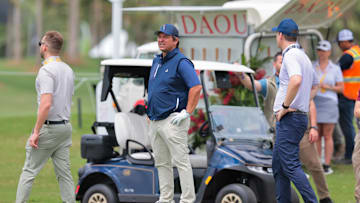 Apr 3, 2025; Miami, Florida, USA; Florida Gov. Ron DeSantis looks on before playing this shot from the ninth tee during the Pro-Am round of the LIV Golf Miami golf tournament at Trump National Doral. Mandatory Credit: Sam Navarro-Imagn Images
