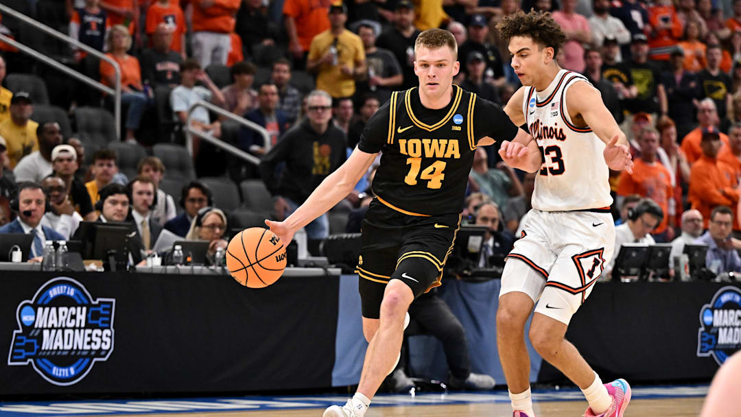 Mar 28, 2026; Houston, TX, USA; Iowa Hawkeyes guard Bennett Stirtz (14) controls the ball against Illinois Fighting Illini guard Keaton Wagler (23) in the first half during the Elite Eight. Mar 28, 2026; Houston, TX, USA; Iowa Hawkeyes guard Bennett Stirtz (14) controls the ball against Illinois Fighting Illini guard Keaton Wagler (23) in the first half during the Elite Eight.
