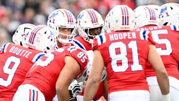 Oct 13, 2024; Foxborough, Massachusetts, USA; New England Patriots quarterback Drake Maye (10) huddles with his teammates  during the first half of a game against the Houston Texans at Gillette Stadium. Mandatory Credit: Brian Fluharty-Imagn Images