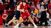 Feb 24, 2025; Lincoln, Nebraska, USA; Nebraska Cornhuskers forward Berke Buyuktuncel (9) drives against Michigan Wolverines forward Will Tschetter (42) during the second half at Pinnacle Bank Arena.