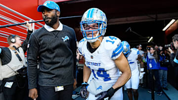 Detroit Lions wide receiver Amon-Ra St. Brown (14) next to assistant quarterbacks coach J.T Barrett and teammates take the field for warm up before the game between San Francisco 49ers and Detroit Lions at Levi's Stadium in Santa Clara, Calif. on Monday, Dec. 30, 2024.