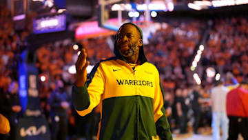 Golden State Warriors forward Draymond Green blows a kiss towards the crowd.