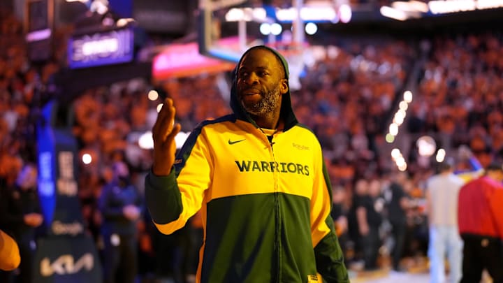 Golden State Warriors forward Draymond Green blows a kiss towards the crowd.
