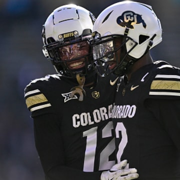 Colorado's Travis Hunter and Shedeur Sanders celebrate a touchdown.