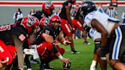 Nov 9, 2024; Raleigh, North Carolina, USA; North Carolina State Wolfpack offensive lineman Rico Jackson (64) holds the ball during the first half of the game against Duke Blue Devils at Carter-Finley Stadium. Mandatory Credit: Jaylynn Nash-Imagn Images