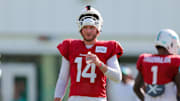 Jul 29, 2025; Miami Gardens, FL, USA; Miami Dolphins quarterback Quinn Ewers (14) hydrates during training camp at Baptist Health Training Complex. Mandatory Credit: Sam Navarro-Imagn Images