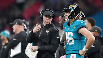 Oct 19, 2025; London, United Kingdom; Jacksonville Jaguars head coach Liam Coen talks with quarterback Trevor Lawrence (16) on the sidelines during the second half of an NFL International Series game at Wembley Stadium. Mandatory Credit: Kirby Lee-Imagn Images