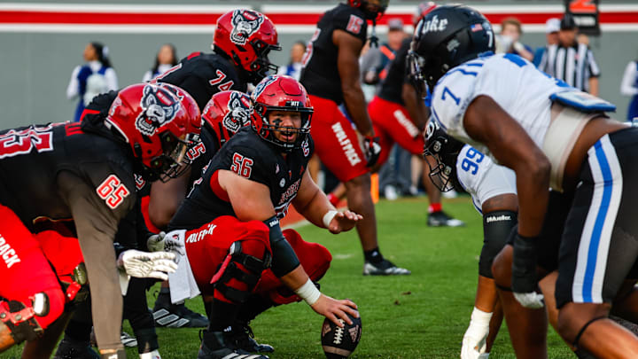 Nov 9, 2024; Raleigh, North Carolina, USA; North Carolina State Wolfpack offensive lineman Rico Jackson (64) holds the ball during the first half of the game against Duke Blue Devils at Carter-Finley Stadium. Mandatory Credit: Jaylynn Nash-Imagn Images Nov 9, 2024; Raleigh, North Carolina, USA; North Carolina State Wolfpack offensive lineman Rico Jackson (64) holds the ball during the first half of the game against Duke Blue Devils at Carter-Finley Stadium. Mandatory Credit: Jaylynn Nash-Imagn Images